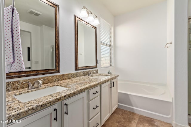 full bathroom with a garden tub and double vanity