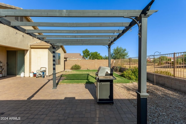 view of patio / terrace with area for grilling, a pergola, and a fenced backyard