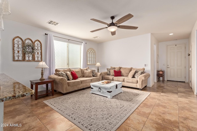 living area with ceiling fan, light tile patterned flooring, and recessed lighting