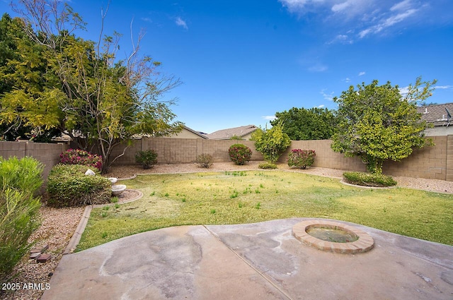 view of yard featuring a patio and a fenced backyard