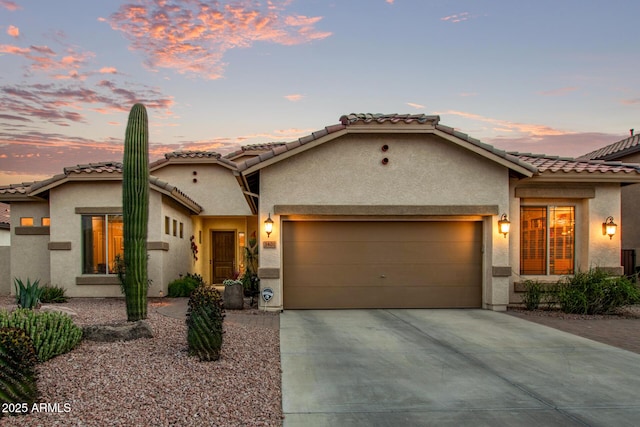 mediterranean / spanish-style house featuring a garage