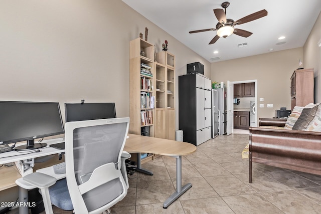 office space featuring light tile patterned floors and ceiling fan