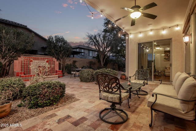 patio terrace at dusk with ceiling fan