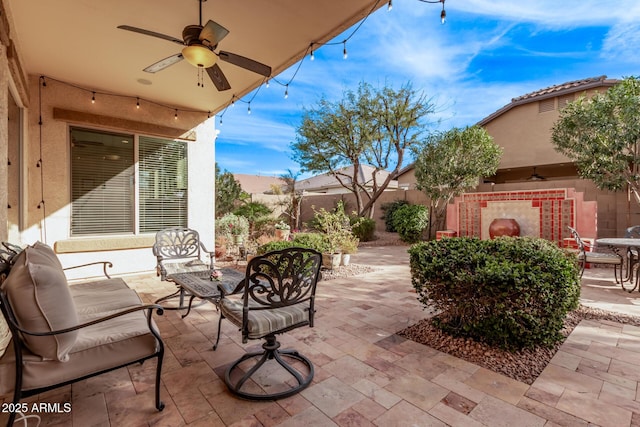 view of patio / terrace with ceiling fan and an outdoor hangout area