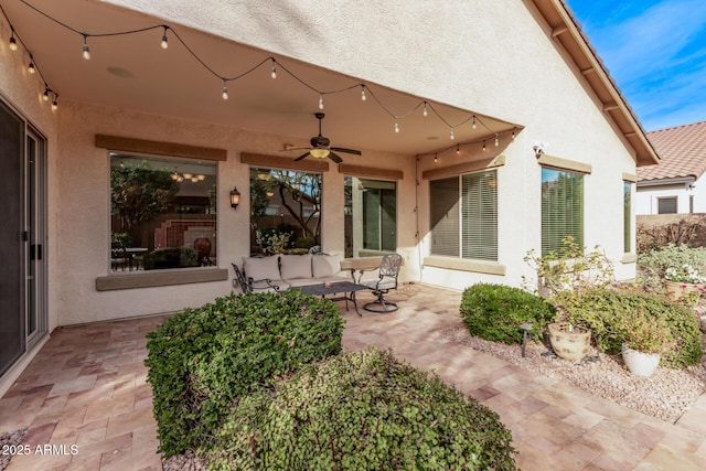 view of patio featuring an outdoor hangout area and ceiling fan