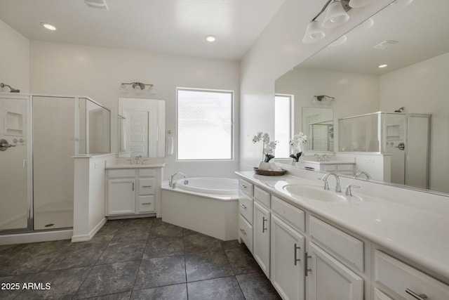 bathroom with shower with separate bathtub and vanity