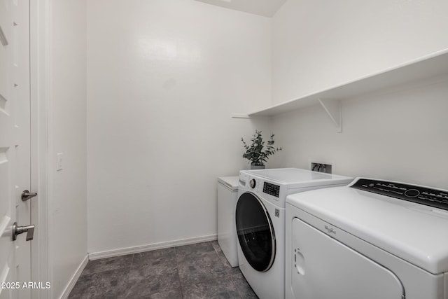 laundry area with washing machine and clothes dryer