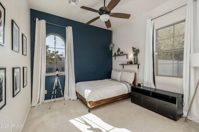 carpeted bedroom featuring ceiling fan