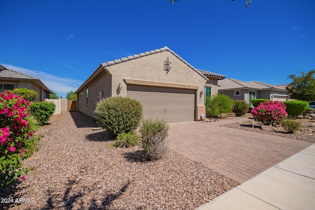 ranch-style home featuring a garage