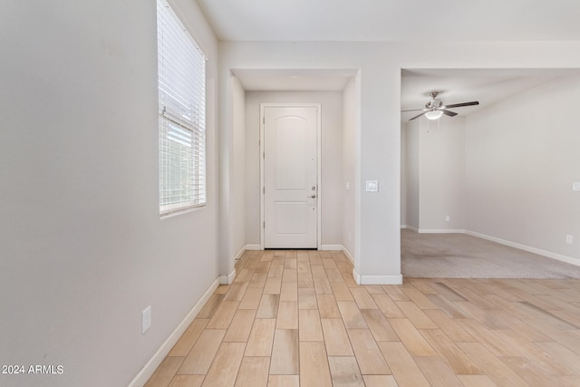 interior space with light hardwood / wood-style flooring and ceiling fan