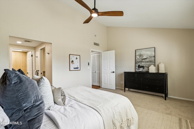 bedroom featuring baseboards, visible vents, ceiling fan, and light colored carpet