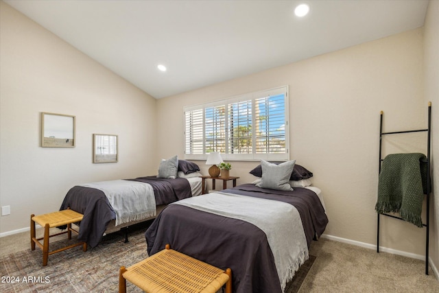 bedroom featuring vaulted ceiling, carpet floors, and baseboards