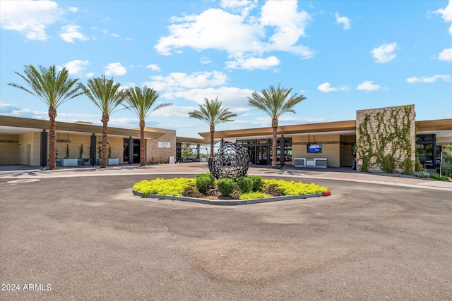 view of property with uncovered parking