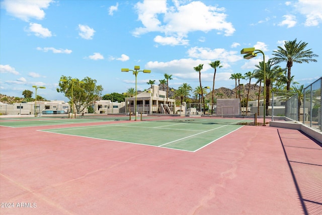 view of sport court featuring community basketball court and fence