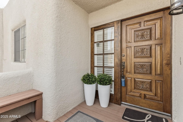 doorway to property with stucco siding