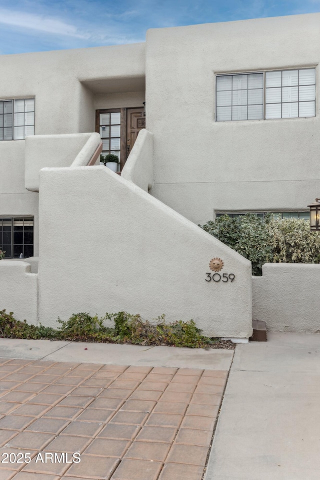 exterior space featuring stucco siding