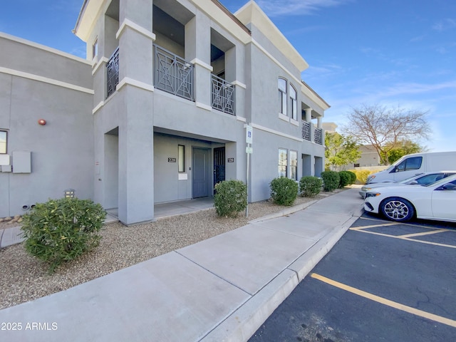 view of property featuring uncovered parking