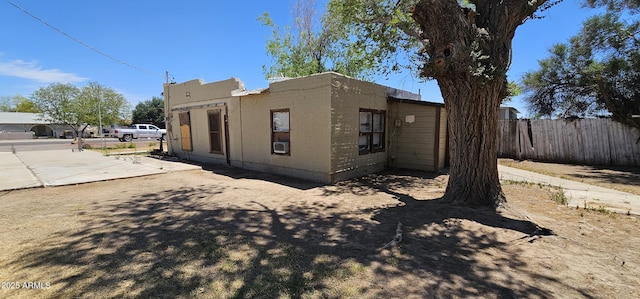 view of home's exterior with fence