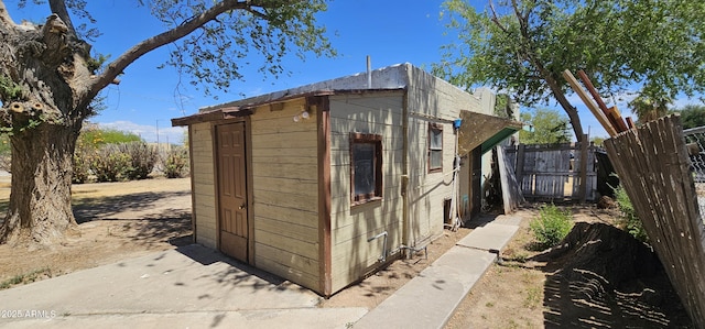view of shed with fence