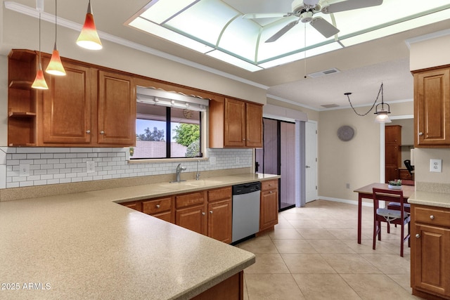 kitchen with brown cabinetry, visible vents, and dishwasher