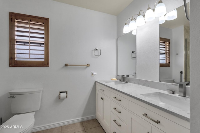 full bath with tile patterned floors, toilet, baseboards, and a sink