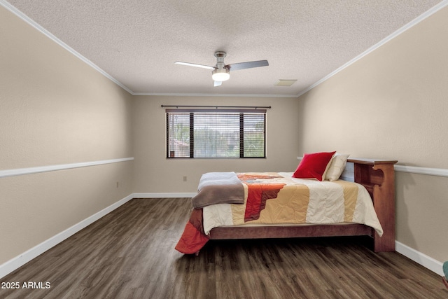 bedroom featuring crown molding, wood finished floors, baseboards, and visible vents