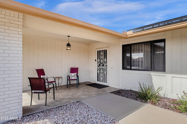 doorway to property featuring a patio area