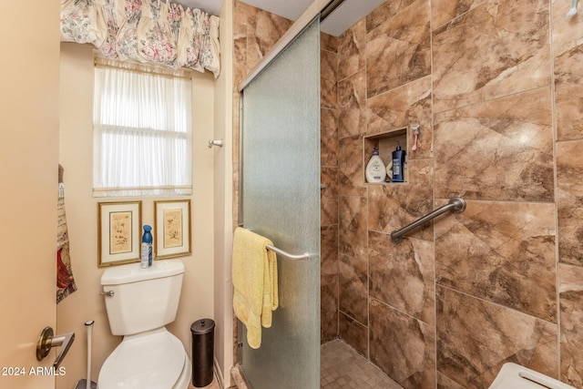 bathroom with toilet and walk in shower