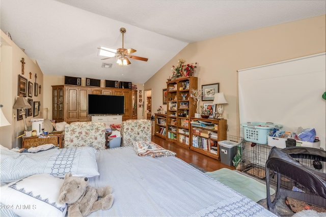 bedroom with lofted ceiling, ceiling fan, and dark wood-type flooring