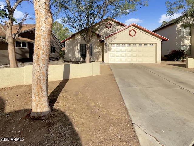 10242 N 66th Ave, Glendale, AZ 85302 - view of front of property with stucco siding, concrete driveway, and an attached garage