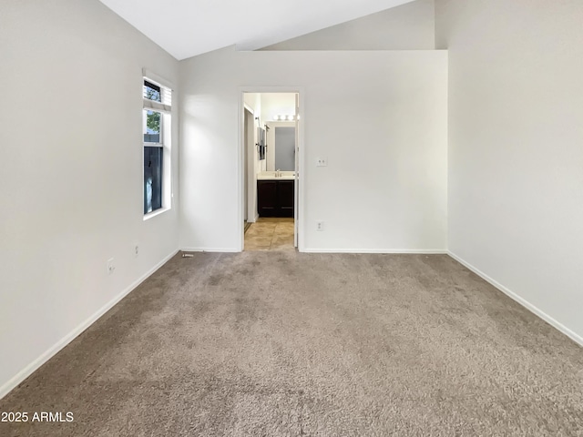 10242 N 66th Ave, Glendale, AZ 85302 - carpeted empty room with lofted ceiling and baseboards
