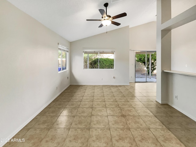 10242 N 66th Ave, Glendale, AZ 85302 - spare room with lofted ceiling, light tile patterned floors, a ceiling fan, and baseboards
