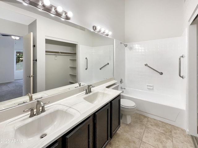 10242 N 66th Ave, Glendale, AZ 85302 - bathroom with toilet, double vanity,  shower combination, and tile patterned floors