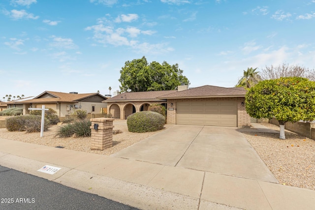 ranch-style home featuring an attached garage, brick siding, driveway, and a shingled roof