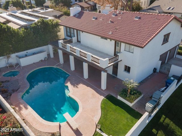 view of swimming pool with a patio area, an in ground hot tub, and a diving board