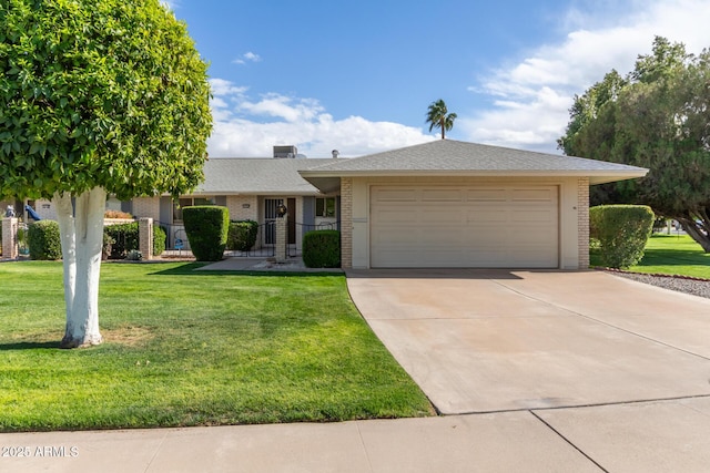 ranch-style home featuring brick siding, an attached garage, concrete driveway, and a front lawn