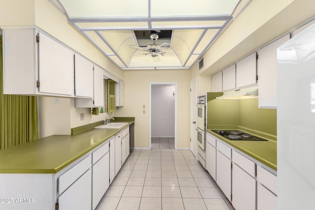 kitchen featuring visible vents, a ceiling fan, under cabinet range hood, double oven, and black electric cooktop