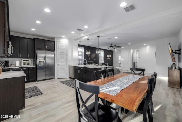 4352 N 91st Gln, Phoenix, AZ 85037 - dining area featuring recessed lighting, a ceiling fan, and light wood finished floors