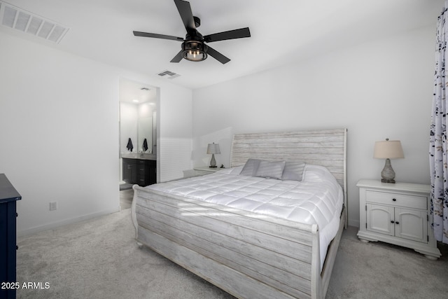 4352 N 91st Gln, Phoenix, AZ 85037 - bedroom featuring light carpet, ceiling fan, connected bathroom, and baseboards