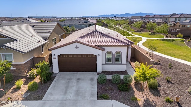 4352 N 91st Gln, Phoenix, AZ 85037 - view of front of house featuring a residential view, stucco siding, an attached garage, and concrete driveway