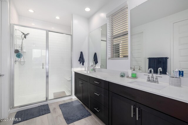 4352 N 91st Gln, Phoenix, AZ 85037 - full bath with a stall shower, vanity, and wood finished floors