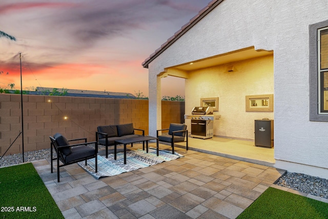 4352 N 91st Gln, Phoenix, AZ 85037 - view of patio with grilling area, fence, and an outdoor hangout area