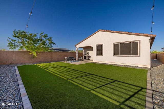 4352 N 91st Gln, Phoenix, AZ 85037 - rear view of property with a patio area and stucco siding