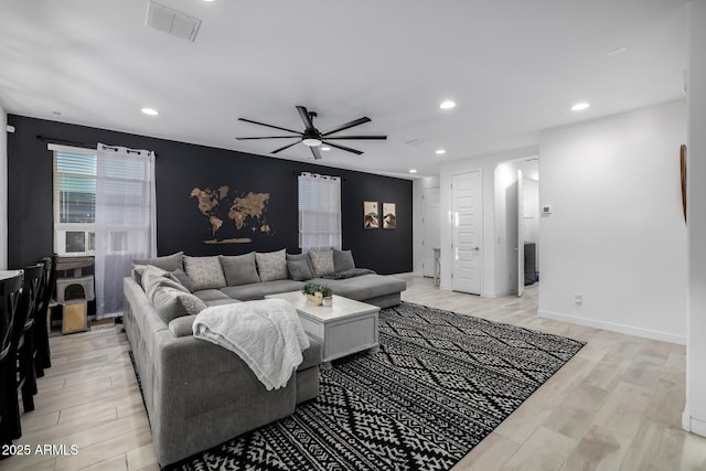 4352 N 91st Gln, Phoenix, AZ 85037 - living area with a ceiling fan, light wood-style flooring, and recessed lighting