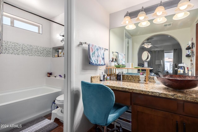 bathroom with visible vents, toilet, tub / shower combination, ceiling fan, and vanity