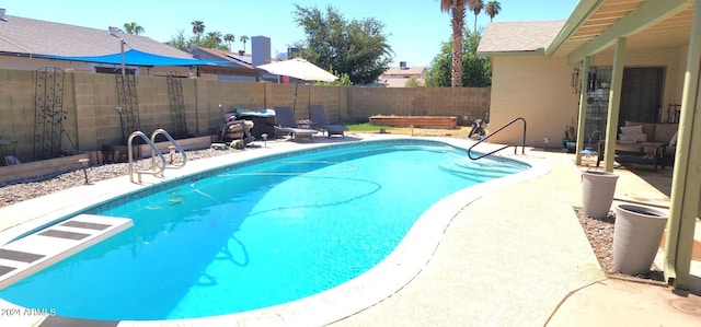 view of pool featuring a fenced in pool, a patio, and a fenced backyard