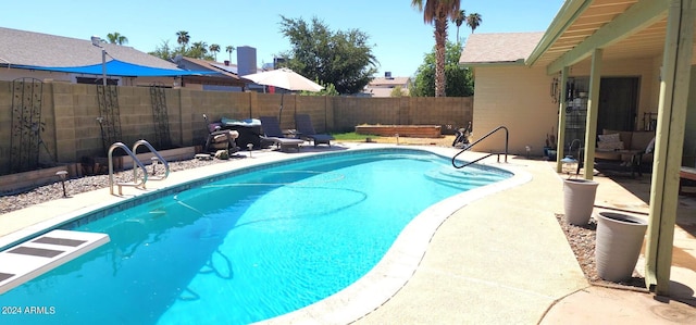 view of pool featuring a fenced in pool, a patio, and a fenced backyard