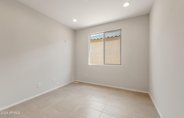 spare room featuring light tile patterned floors