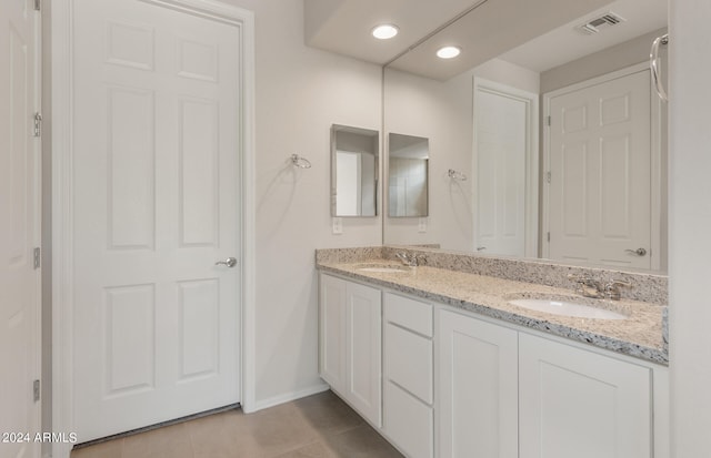 bathroom with vanity and tile patterned flooring