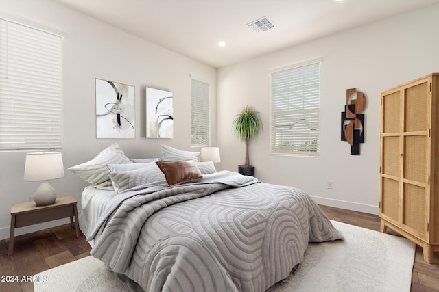 bedroom featuring dark hardwood / wood-style floors